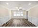 Bright dining room featuring wood floors, recessed lighting, and wainscoting at 1890 Carla Dr, Morrow, GA 30260