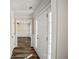 Light-filled entryway features a white front door, modern flooring, and wainscoting at 1890 Carla Dr, Morrow, GA 30260