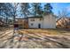 Exterior view of the back of the home showing the yard, and the raised back porch at 1890 Carla Dr, Morrow, GA 30260