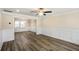 Spacious living room featuring modern flooring, wainscoting, and a view into the dining area at 1890 Carla Dr, Morrow, GA 30260