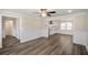 Open floorplan with wood floors that connects the kitchen and dining areas at 1890 Carla Dr, Morrow, GA 30260