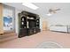 Carpeted basement featuring a large entertainment center and a neutral color scheme at 2333 Sheridan Ct, Villa Rica, GA 30180