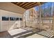 Under deck patio area with a garage door feature and white picket fence at 2333 Sheridan Ct, Villa Rica, GA 30180