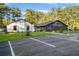 Exterior of recreation center, featuring ample parking and lush landscaping in a community setting at 2333 Sheridan Ct, Villa Rica, GA 30180