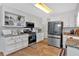 Bright kitchen featuring stainless steel appliances, granite countertops, and ample cabinet space at 360 Chimney Ct, Fairburn, GA 30213