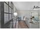 Bright living room features modern decor, wood laminate flooring, and shiplap walls at 360 Chimney Ct, Fairburn, GA 30213