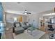 Cozy living room with wood plank walls, modern ceiling fan, and contemporary decor at 360 Chimney Ct, Fairburn, GA 30213