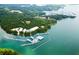 Scenic aerial view of the lake with a marina and surrounded by lush green forest at 3790 Chattahoochee (Lot 33) Rd, Cumming, GA 30041