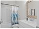 Bright bathroom with a modern vanity and shower-tub combo at 3790 Chattahoochee (Lot 33) Rd, Cumming, GA 30041