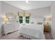 Cozy bedroom with a white bed, dresser, and window overlooking the yard at 3790 Chattahoochee (Lot 33) Rd, Cumming, GA 30041