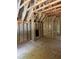 Spacious bedroom with framed walls, revealing closet and the initial stages of construction and design at 3790 Chattahoochee (Lot 33) Rd, Cumming, GA 30041