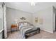 Neutral bedroom with an accent wall, decor, area rug, and furnishings create a pleasing, inviting living space at 3790 Chattahoochee (Lot 33) Rd, Cumming, GA 30041
