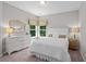 Bright bedroom featuring a white headboard, neutral-toned bedding and decor, and a large window at 3790 Chattahoochee (Lot 33) Rd, Cumming, GA 30041