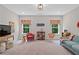Large bonus room with comfortable seating, tv, and natural light at 3790 Chattahoochee (Lot 33) Rd, Cumming, GA 30041
