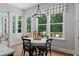 Cozy breakfast nook with natural light from large windows overlooking the backyard deck at 3790 Chattahoochee (Lot 33) Rd, Cumming, GA 30041