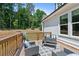 Outdoor wooden deck featuring patio furniture and a view of the home's exterior at 3790 Chattahoochee (Lot 33) Rd, Cumming, GA 30041