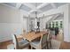 Bright and airy dining room with a view of the staircase and second-floor living area at 3790 Chattahoochee (Lot 33) Rd, Cumming, GA 30041