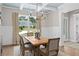Bright dining room with modern chandelier and view of home exterior at 3790 Chattahoochee (Lot 33) Rd, Cumming, GA 30041