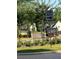 Community entrance and signage with stone pillars and lush landscaping at 3790 Chattahoochee (Lot 33) Rd, Cumming, GA 30041