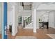 Grand foyer with hardwood floors, staircase, and views into the living and dining areas at 3790 Chattahoochee (Lot 33) Rd, Cumming, GA 30041