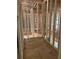The framing for a new home creates an open and airy space as it approaches completion at 3790 Chattahoochee (Lot 33) Rd, Cumming, GA 30041