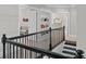 View of upstairs hallway with doors leading to various rooms, including a play area and dressing area at 3790 Chattahoochee (Lot 33) Rd, Cumming, GA 30041