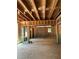Living room under construction, showing wood framing, windows, and potential for a spacious design at 3790 Chattahoochee (Lot 33) Rd, Cumming, GA 30041