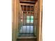 View of living room in construction with stud framing and natural light from backyard windows at 3790 Chattahoochee (Lot 33) Rd, Cumming, GA 30041