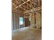 Spacious living room under construction, showcasing a window and the home's overall open layout at 3790 Chattahoochee (Lot 33) Rd, Cumming, GA 30041