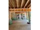 Unfinished living room, showcasing the wall framing, wooden floors, and light filled windows at 3790 Chattahoochee (Lot 33) Rd, Cumming, GA 30041