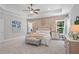 Bright main bedroom with trey ceiling, neutral palette, natural light, and stylish decor and furnishings at 3790 Chattahoochee (Lot 33) Rd, Cumming, GA 30041