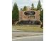 Attractive stone entrance to Port Royale Marina with waterfall feature and retail business advertisement at 3790 Chattahoochee (Lot 33) Rd, Cumming, GA 30041