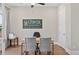 Office space featuring a desk, gray chairs, and natural light at 3790 Chattahoochee (Lot 33) Rd, Cumming, GA 30041