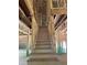 Unfinished staircase area featuring wooden steps and framing at 3790 Chattahoochee (Lot 33) Rd, Cumming, GA 30041