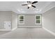 Spacious bedroom featuring neutral paint, recessed lighting, and two windows at 3790 Chattahoochee Rd, Cumming, GA 30041