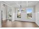 Dining room with natural light, hardwood floors, and wainscoting at 3790 Chattahoochee (Lot 33) Rd, Cumming, GA 30041