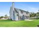 New construction home featuring light blue siding, white trim, and a spacious green lawn at 3790 Chattahoochee Rd, Cumming, GA 30041