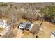 An aerial view reveals the house, solar panels, deck, gazebo, and fenced backyard at 71 Riverside Ct, Douglasville, GA 30134