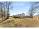 Expansive backyard with a wooden deck, gazebo, and partial fence, perfect for outdoor activities at 71 Riverside Ct, Douglasville, GA 30134