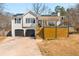 Charming home featuring a garage and modern deck in a residential neighborhood at 71 Riverside Ct, Douglasville, GA 30134