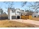 Charming home featuring a garage and modern deck in a residential neighborhood at 71 Riverside Ct, Douglasville, GA 30134