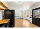 Eat-in kitchen area features bright windows and seamless access to modern kitchen finishes and hardwood floors at 71 Riverside Ct, Douglasville, GA 30134