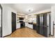 Modern kitchen with stainless steel appliances, butcher block countertops, and hardwood floors at 71 Riverside Ct, Douglasville, GA 30134