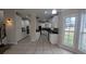 Open kitchen design with white cabinets, and tile floors at 1205 Peeksville Rd, Locust Grove, GA 30248