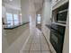 Open kitchen design with white cabinets, and tile floors at 1205 Peeksville Rd, Locust Grove, GA 30248