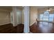 Bright living room featuring hardwood floors, modern ceiling fan, and large windows at 1205 Peeksville Rd, Locust Grove, GA 30248