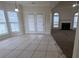 Bright living room featuring tile floors and views to the backyard at 1205 Peeksville Rd, Locust Grove, GA 30248