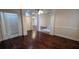 Spacious living room featuring hardwood floors, modern ceiling fan, and large windows at 1205 Peeksville Rd, Locust Grove, GA 30248