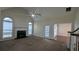 Large living room with fireplace, carpeted floors, and large windows at 1205 Peeksville Rd, Locust Grove, GA 30248