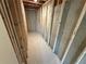 Unfinished basement hallway with exposed framing and concrete walls at 3904 Allegretto Cir # 50, Atlanta, GA 30339